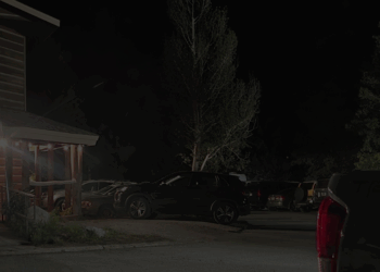 vehicle parked in parking lot on spring creek ranch in jackson hole wyoming